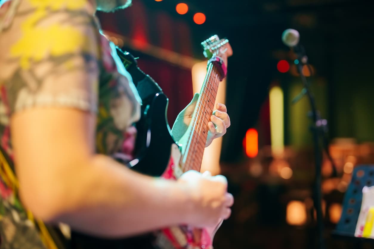 Musicians playing guitar on stage