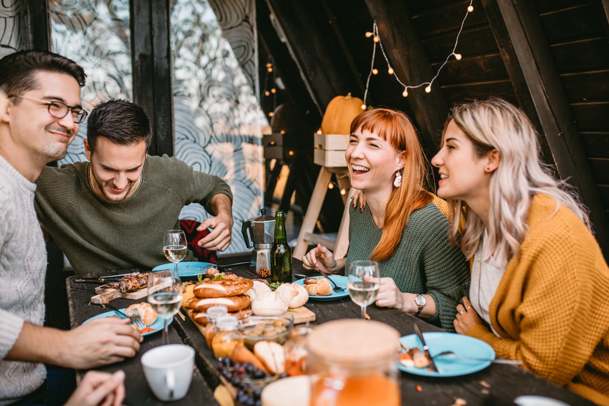 Smiling group of friends having lunch together.